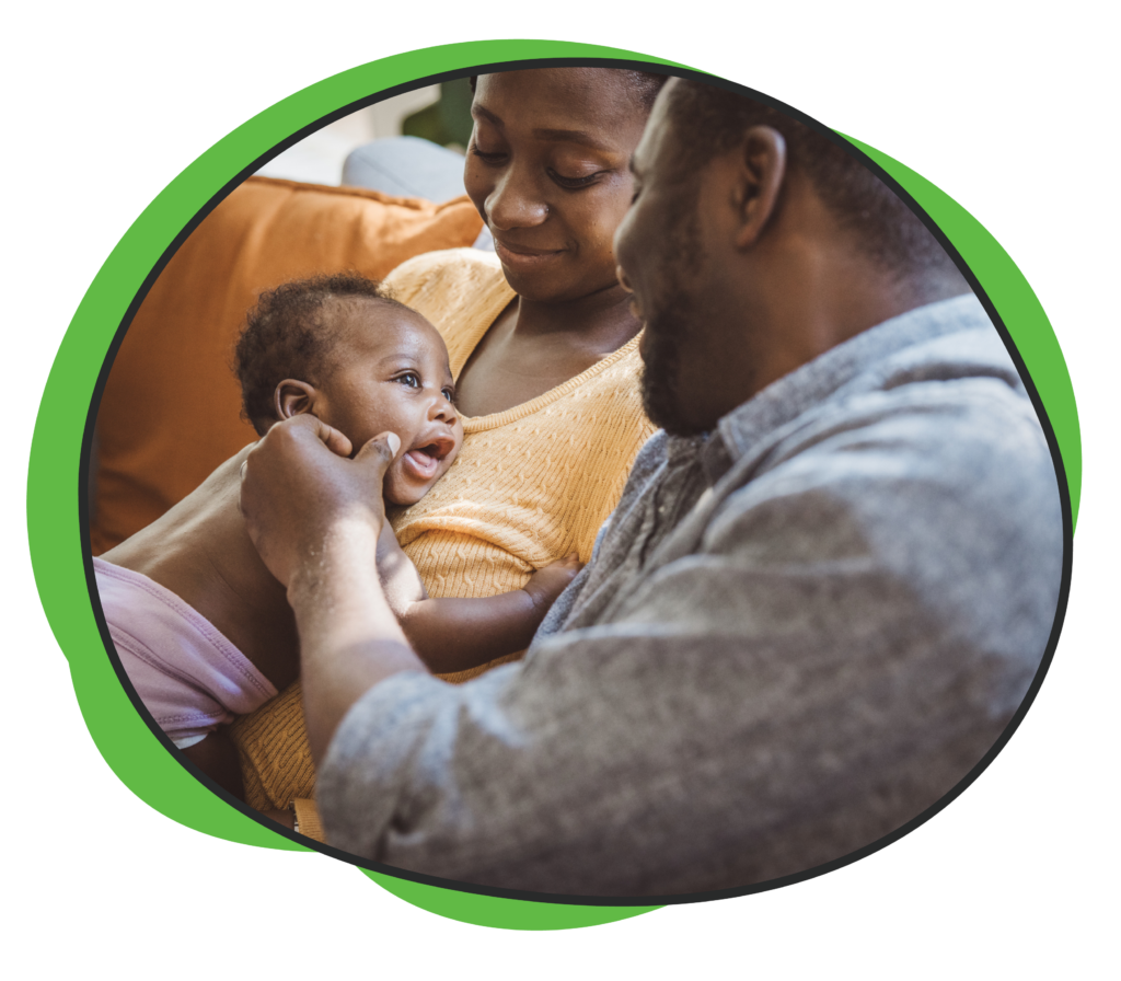 father and mother with newborn baby